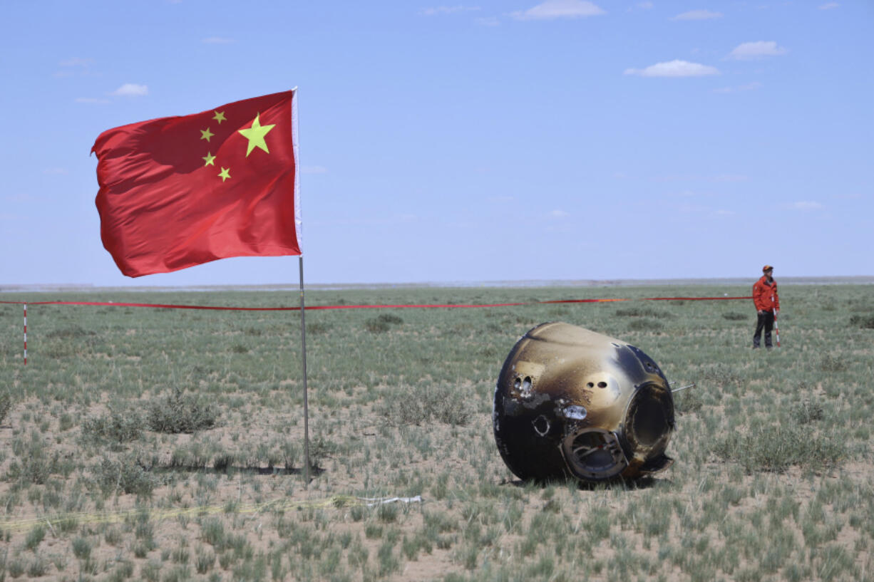 In this photo released by Xinhua News Agency, the return capsule of the Chang&rsquo;e 6 probe is seen in Siziwang Banner, northern China&rsquo;s Inner Mongolia Autonomous Region on Tuesday, June 25, 2024. China&rsquo;s Chang&rsquo;e 6 probe has returned on Earth with rock and soil samples from the little-explored far side of the moon in a global first.