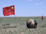 In this photo released by Xinhua News Agency, the return capsule of the Chang&rsquo;e 6 probe is seen in Siziwang Banner, northern China&rsquo;s Inner Mongolia Autonomous Region on Tuesday, June 25, 2024. China&rsquo;s Chang&rsquo;e 6 probe has returned on Earth with rock and soil samples from the little-explored far side of the moon in a global first.
