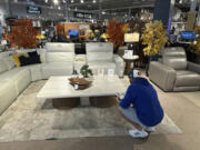 A shopper pauses at a display in a furniture store Sunday, June 2, 2024, in Englewood, Colo. On Wednesday, June 12, 2024, the Labor Department issues its report on prices at the consumer level in May.