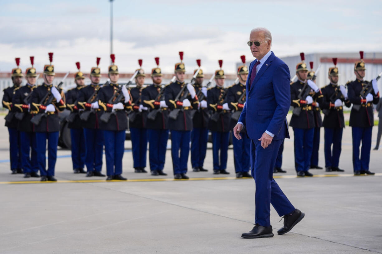 President Joe Biden walks next to a French honour guard after arriving at Orly airport, south of Paris, Wednesday, June 5, 2024. Biden is in France to mark the 80th anniversary of D-Day.