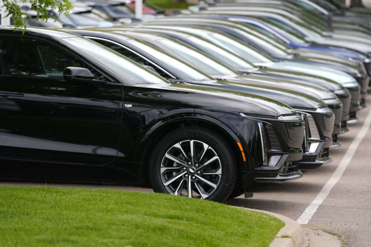 FILE - Vehicles sit in a row outside a dealership, June 2, 2024, in Lone Tree, Colo. Car dealerships across North America have faced a major disruption this week. CDK Global, a company that provides software for thousands of auto dealers in the U.S. and Canada, was hit by back-to-back cyberattacks on Wednesday, June 19, 2024.