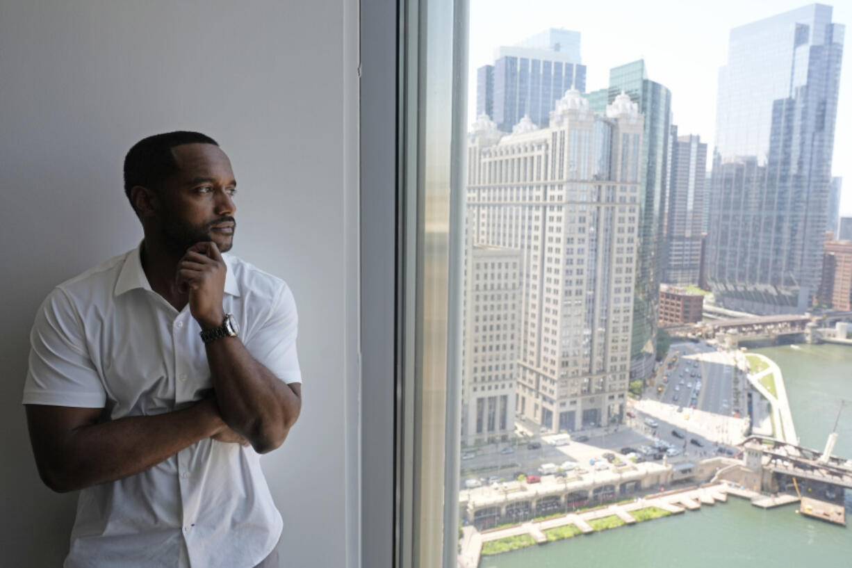 Adrian Perkins stands for a portrait in his office in Chicago, Thursday, June 13, 2024. (AP Photo/Nam Y.