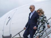 President Joe Biden, left, and first lady Jill Biden arrive at McGuire Air Force Base, Saturday, June 29, 2024, in Burlington County, N.J.