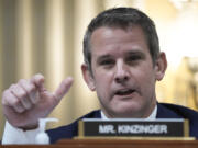 FILE -Rep. Adam Kinzinger, R-Ill., speaks as the House select committee investigating the Jan. 6 attack on the U.S. Capitol holds its final meeting on Capitol Hill in Washington, Dec. 19, 2022. Kinzinger, former congressman, endorsed President Joe Biden on Wednesday, giving the Democrat a prominent new ally in his high-stakes campaign to win over moderate Republicans and independents this fall.