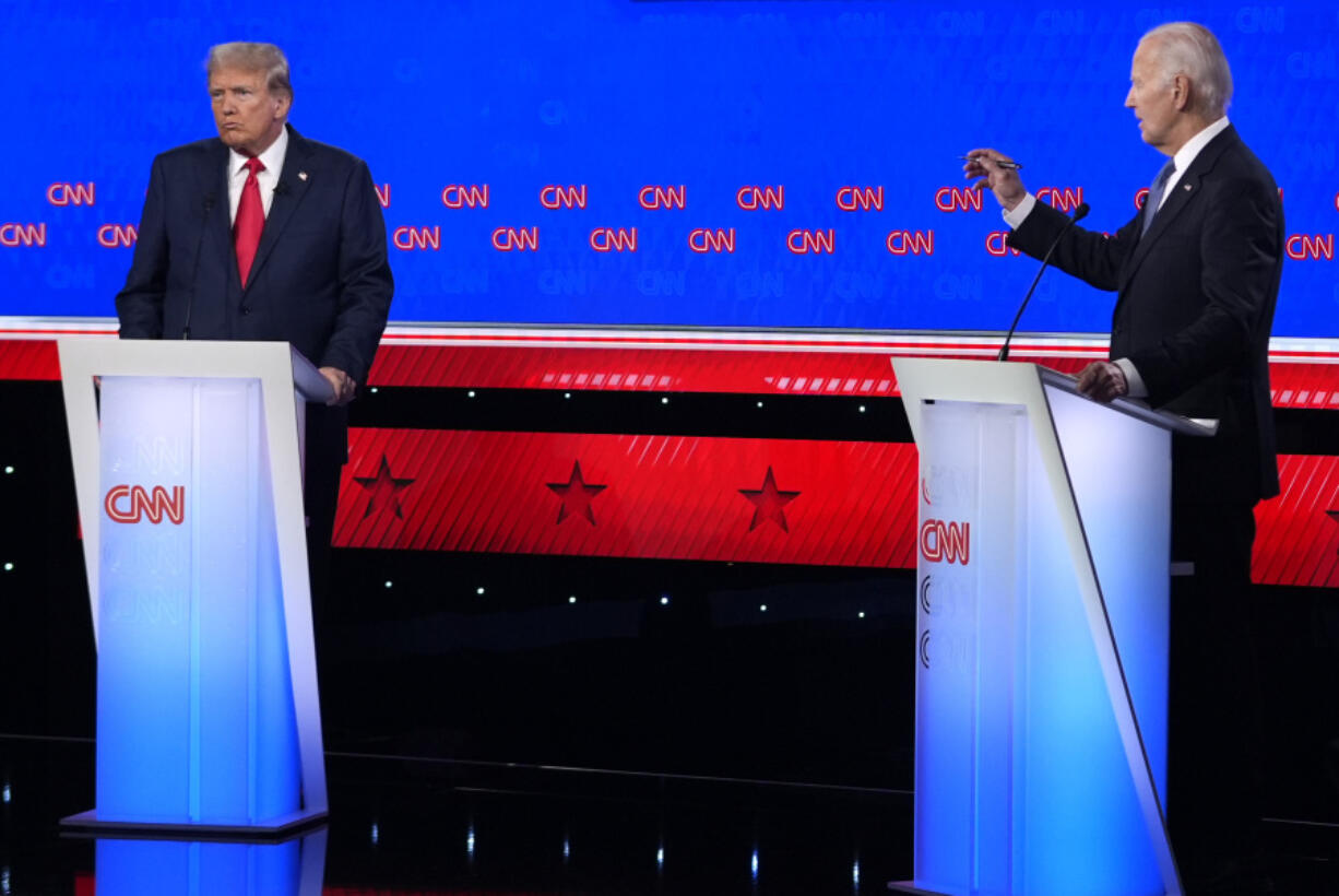 President Joe Biden, right, and Republican presidential candidate former President Donald Trump, left, participate in a presidential debate hosted by CNN, Thursday, June 27, 2024, in Atlanta.