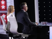 CNN&rsquo;s Dana Bash, left, and Jake Tapper listen as they moderate a presidential debate between President Joe Biden and Republican presidential candidate former President Donald Trump, Thursday, June 27, 2024, in Atlanta.