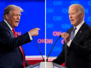 This combination of photos shows Republican presidential candidate former President Donald Trump, left, and President Joe Biden during a presidential debate hosted by CNN, Thursday, June 27, 2024, in Atlanta.