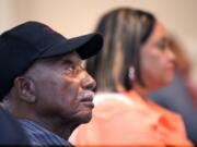 Clarence Picou, 88, right, and his daughter Jackie Andrews, 59, watch the presidential debate between President Joe Biden and former President Donald Trump, Thursday, June 27, 2024, in the Fellowship Hall of the Stronger Hope Church in Jackson, Miss. (AP Photo/Rogelio V.