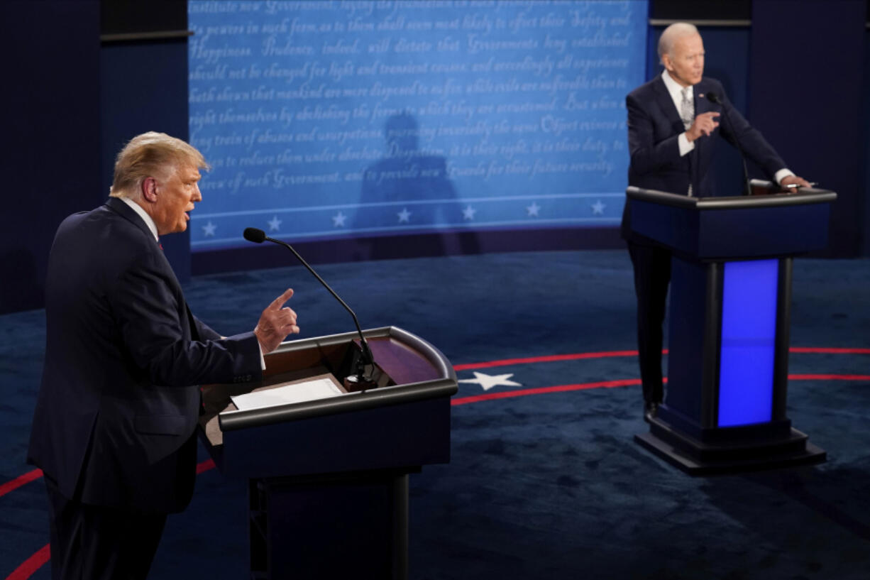 FILE - President Donald Trump and Democratic presidential candidate former Vice President Joe Biden debate during the first presidential debate Sept. 29, 2020, at Case Western University and Cleveland Clinic, in Cleveland.