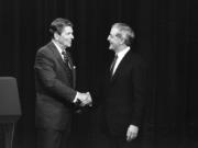 FILE - President Ronald Reagan, left, and his Democratic challenger Walter Mondale, shake hands before debating in Kansas City, Mo., Oct. 22, 1984.