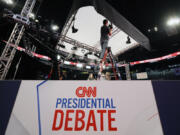 FILE - Ben Starett, lighting programmer for CNN, sets up lights in the spin room for the presidential debate between President Joe Biden and Republican presidential candidate former President Donald Trump in Atlanta, Wednesday, June 26, 2024.