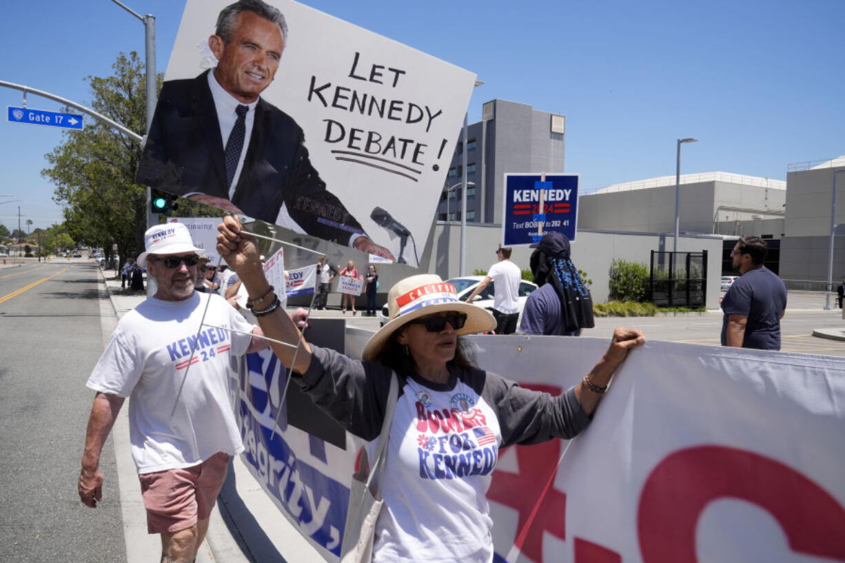 Supporters of Presidential candidate Robert F. Kennedy Jr. protest outside the Warner Bros. Studios in Burbank, Calif., Friday, June 21, 2024. Warner Bros. Discovery, CNN&rsquo;s parent company, plans to relocate to its Burbank studios.  Host network CNN said Thursday the independent presidential candidate fell short of benchmarks both for state ballot qualification and polling. The missed markers mean the June 27 showdown will be solely between President Joe Biden and Donald Trump.