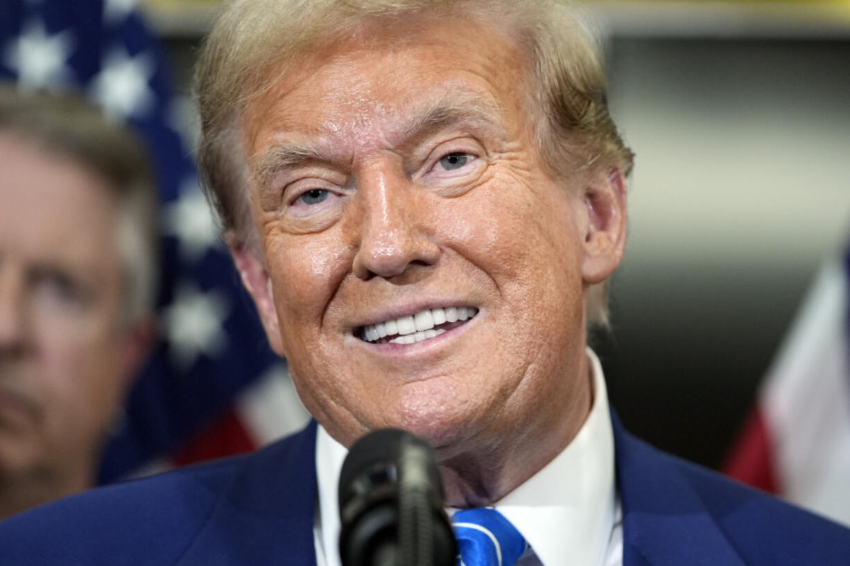 Republican presidential candidate former President Donald Trump speaks with reporters at the National Republican Senatorial Committee, Thursday, June 13, 2024, in Washington.