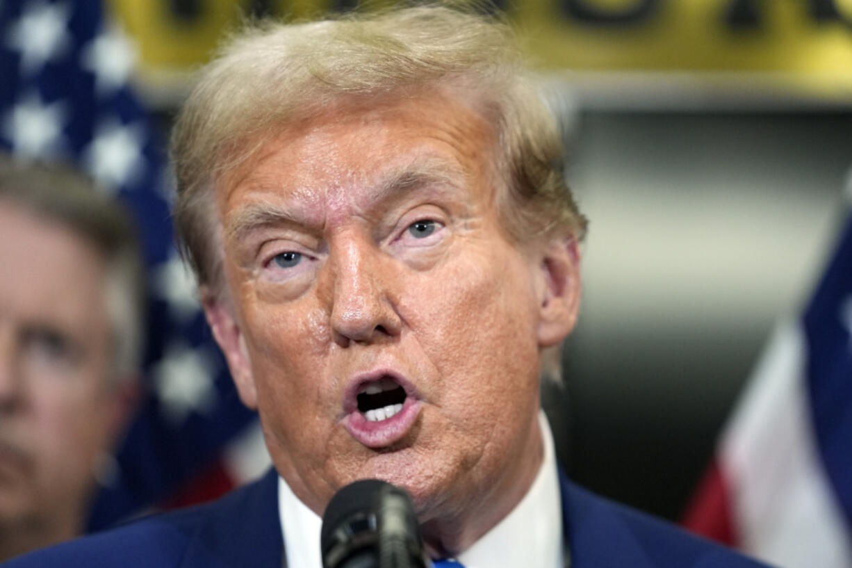 Former President Donald Trump speaks to reporters at the National Republican Senatorial Committee, Thursday, June 13, 2024, in Washington.