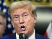 Former President Donald Trump speaks to reporters at the National Republican Senatorial Committee, Thursday, June 13, 2024, in Washington.