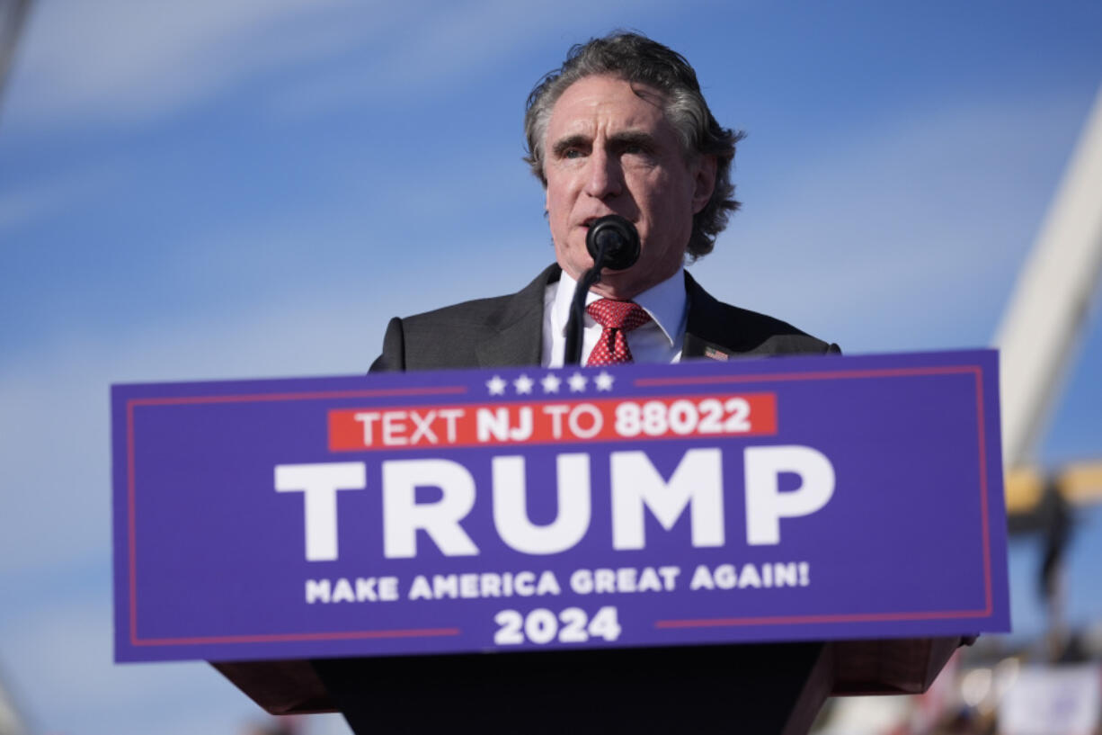 FILE - North Dakota Gov. Doug Burgum speaks during a rally in Wildwood, N.J., May 11, 2024. Burgum is one of Donald Trump&rsquo;s most visible and vocal backers,  sprinting around the country to drum up support while auditioning to be his running mate. Meanwhile, Burgum is wrestling with a mammoth carbon dioxide pipeline project in his home state. The $5.5 billion venture has split North Dakota and left him straddling an awkward political divide as Trump and President Joe Biden offer voters starkly different visions of America.