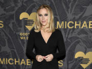 FILE - Scarlett Johansson attends the Golden Heart Awards, Oct. 16, 2023, in New York. Research shows that chatbots and fake social media accounts get more engagement when they have female personas because people are more likely to view women as warm and approachable, and to see chatbots with female personas as more human than those posing as male. Johansson declined OpenAI CEO Sam Altman&rsquo;s request to voice the ChatGPT AI program and threatened to sue when the company went with what she called an &ldquo;eerily similar&rdquo; voice. OpenAI put the new voice on hold.