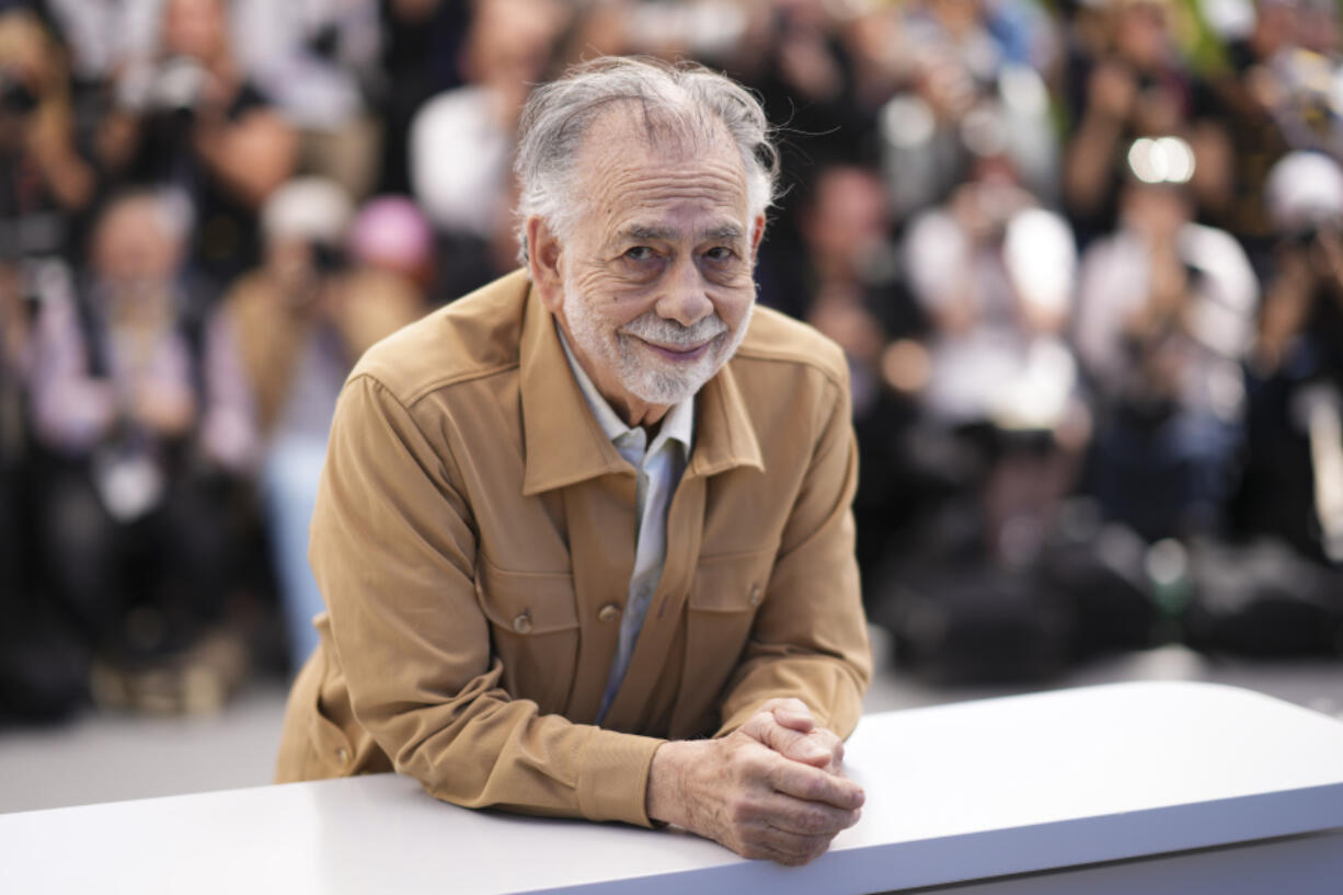 FILE - Director Francis Ford Coppola poses for photographers at the photo call for the film &ldquo;Megalopolis&rdquo; at the 77th international film festival, Cannes, southern France, Friday, May 17, 2024. Lionsgate will distribute &ldquo;Megalopolis&rdquo; in U.S. and Canadian theaters, the studio announced Monday, ending one of the biggest acquisition dramas of the year.