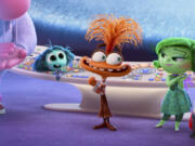 This image released by Disney/Pixar shows, from left, Joy, voiced by Amy Poehler, Embarrassment, voiced by Paul Walter Hauser,  Envy, voiced by Ayo Edebiri, Anxiety, voiced by Maya Hawke, Disgust, voiced by Liza Lapira, Anger,  voiced by Lewis Black (foreground), Fear, voiced by Tony Hale, and Sadness, voiced by Phyllis Smith, in a scene from &ldquo;Inside Out 2.&rdquo; (Disney/Pixar via AP)