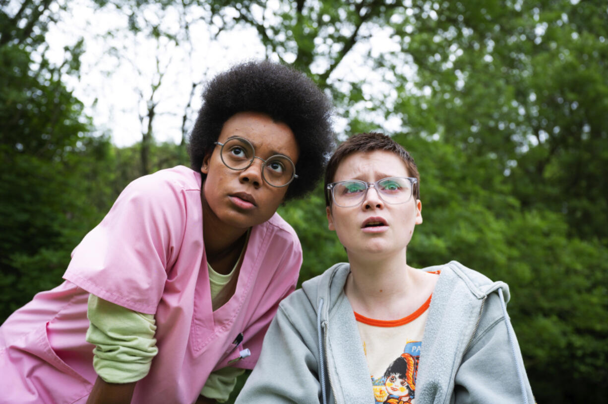 This image released by A24 shows Leah Harvey, left, and Lola Petticrew in a scene from &ldquo;Tuesday.&rdquo; (Kevin Baker/A24 via AP)