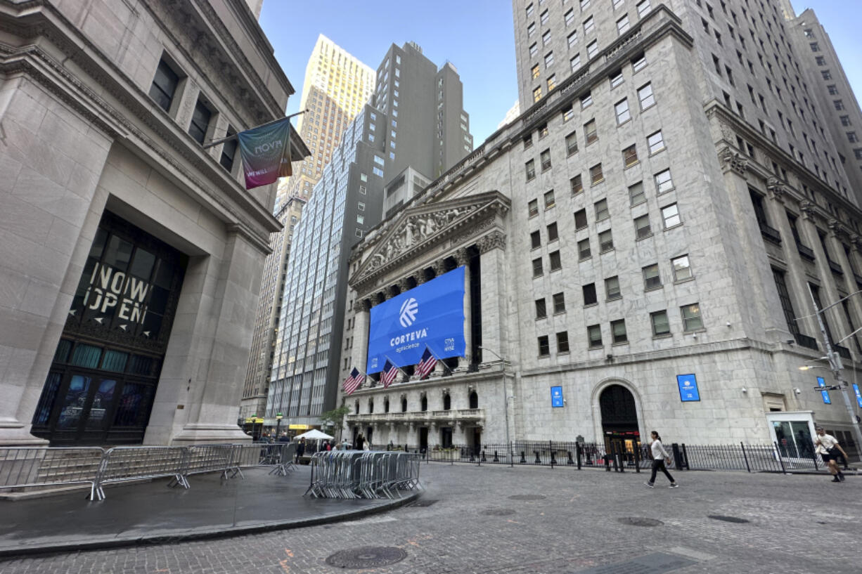 The New York Stock Exchange, center, is shown on Tuesday, June 4, 2024. Shares in Europe and Asia were mostly lower on Tuesday after a report showed that U.S. manufacturing contracted in May.