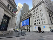 The New York Stock Exchange, center, is shown on Tuesday, June 4, 2024. Shares in Europe and Asia were mostly lower on Tuesday after a report showed that U.S. manufacturing contracted in May.