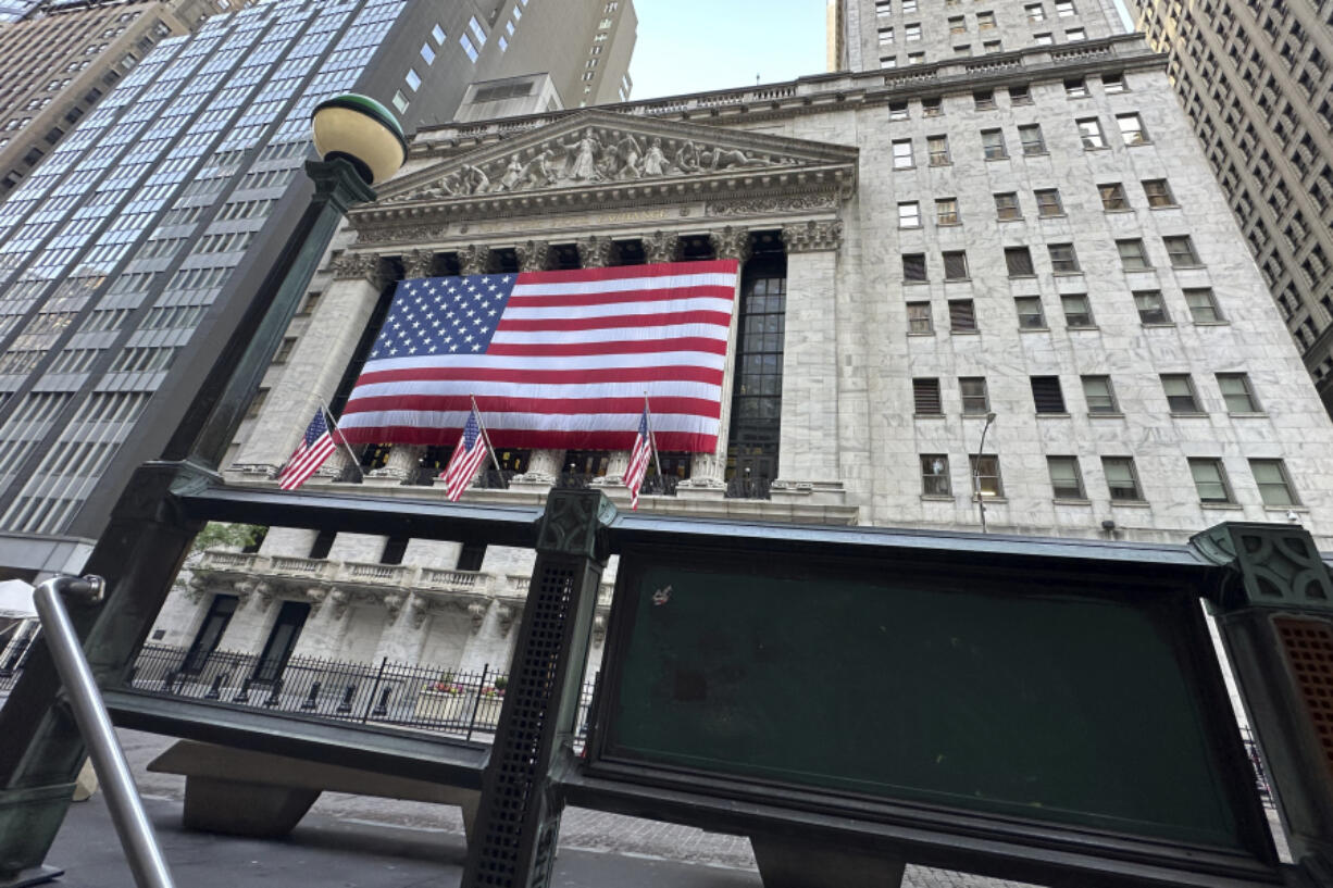 FILE - The New York Stock Exchange is framed by a subway entrance on Tuesday, May 28, 2024 in New York. World stocks are higher on Thursday, June 6, 2024, after Wall Street barreled to new records as the frenzy around artificial-intelligence technology keeps sending stocks higher.