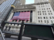 FILE - The New York Stock Exchange is framed by a subway entrance on Tuesday, May 28, 2024 in New York. World stocks are higher on Thursday, June 6, 2024, after Wall Street barreled to new records as the frenzy around artificial-intelligence technology keeps sending stocks higher.