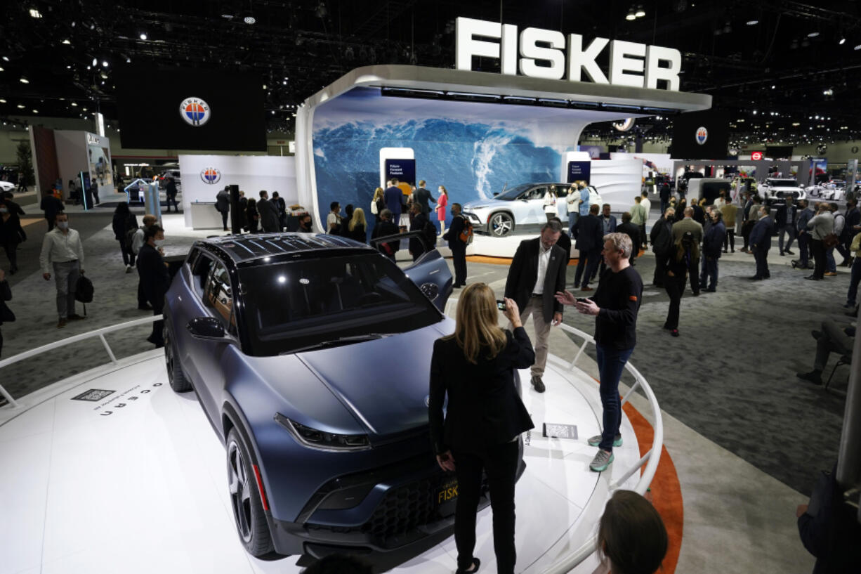 FILE - Henrik Fisker, Chairman &amp; CEO at Fisker Inc. at right, shows his company&rsquo;s new EV, the Ocean, at the AutoMobility LA Auto Show Nov. 17, 2021, in Los Angeles. Fisker filed for Chapter 11 bankruptcy protection, Monday, June 17, 2024, the second electric startup to do so in the last year as even industry leaders struggle to lure more buyers beyond the early adapters of the technology.