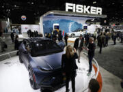 FILE - Henrik Fisker, Chairman &amp; CEO at Fisker Inc. at right, shows his company&rsquo;s new EV, the Ocean, at the AutoMobility LA Auto Show Nov. 17, 2021, in Los Angeles. Fisker filed for Chapter 11 bankruptcy protection, Monday, June 17, 2024, the second electric startup to do so in the last year as even industry leaders struggle to lure more buyers beyond the early adapters of the technology.