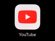 FILE - The YouTube app is seen on an iPad, March 20, 2018, in Baltimore. YouTube announced Wednesday, June 5, 2024, that it is changing its policies about firearm videos in an effort to keep potentially dangerous content from reaching underage users.