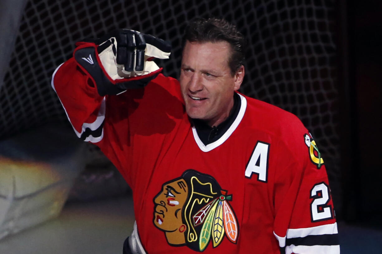 FILE - Former Chicago Blackhawks player Jeremy Roenick acknowledges the crowd after being honored before an NHL hockey game between the Vancouver Canucks and the Blackhawks, Sunday, Jan. 22, 2017, in Chicago. Roenick has been elected to the Hockey Hall of Fame after being eligible for more than a decade. (AP Photo/Nam Y.