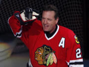 FILE - Former Chicago Blackhawks player Jeremy Roenick acknowledges the crowd after being honored before an NHL hockey game between the Vancouver Canucks and the Blackhawks, Sunday, Jan. 22, 2017, in Chicago. Roenick has been elected to the Hockey Hall of Fame after being eligible for more than a decade. (AP Photo/Nam Y.