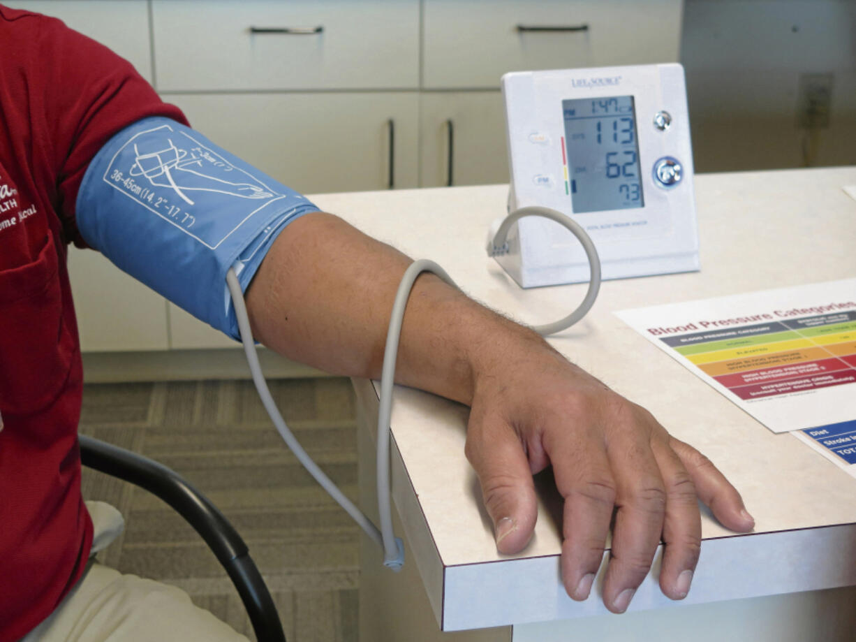 FILE - A Care Home Delivery Technician gets his blood pressure checked at Augusta Health in Fishersville, Va., on Wednesday, Feb. 6, 2019. Racial and ethnic inequities in health care are found in every state in the U.S. despite some progress over the past two decades, according to a new national report released Wednesday, June 26, 2024. (Rebecca J.