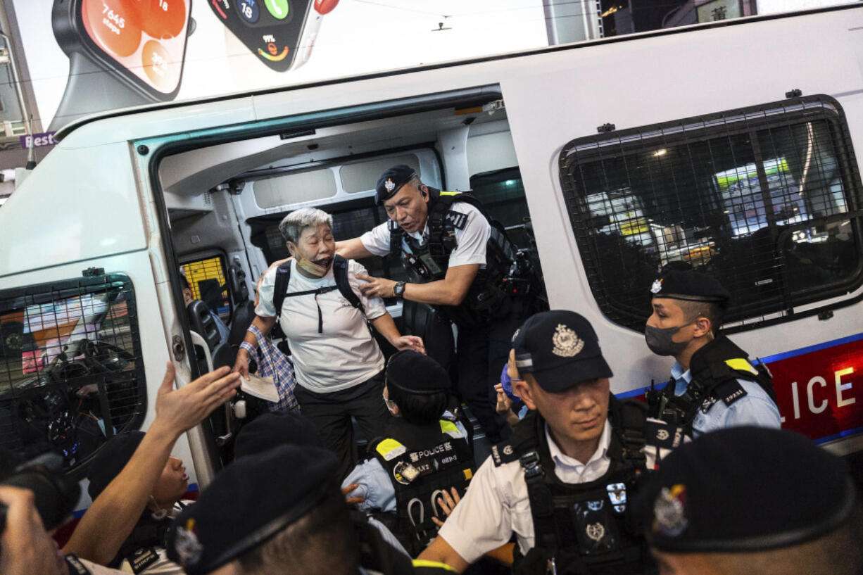 Police officers detained a resident in Causeway Bay area on the 35th anniversary of China&rsquo;s Tiananmen Square crackdown, in Hong Kong, Tuesday, June 4, 2024.