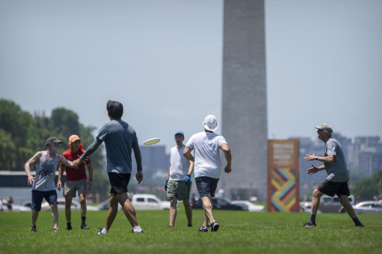 People play ultimate Frisbee on the National Mall in Washington, Wednesday, June 19, 2024. High temperatures are expected to stay in the 90s in the nation&#039;s capital for the rest of the week as a heat wave builds into the Northeast.