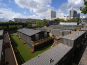 The gated micro community known as &ldquo;The Melody&rdquo; is shown Friday, April 12, 2024, in Atlanta. The Melody is a housing complex made from shipping containers and is intended to help house people from Atlanta&rsquo;s homeless population.