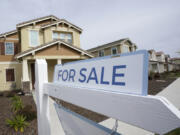 FILE - A for sale sign is posted in front of a home in Sacramento, Calif., March 3, 2022. The Biden administration is announcing new federal initiatives to increase access to affordable housing as high interest rates and still-high prices on groceries and other necessities have dramatically pushed up the cost of living in the post-pandemic years. Treasury Secretary Janet Yellen is traveling to Minneapolis on Monday, June 24, 2024, to promote the new investments.