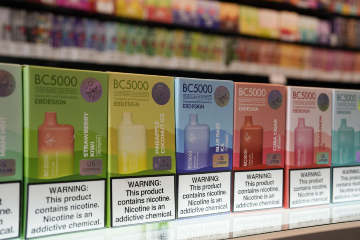 FILE - Varieties of disposable flavored electronic cigarette devices manufactured by EB Design, formerly known as Elf Bar, are displayed at a store in Pinecrest, Fla., June 26, 2023. Health and law enforcement officials are set to face congressional questioning over the rise of illegal electronic cigarettes in the U.S., a multibillion-dollar business that has flourished amid haphazard enforcement by regulators.