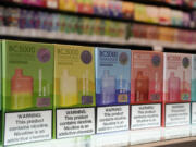 FILE - Varieties of disposable flavored electronic cigarette devices manufactured by EB Design, formerly known as Elf Bar, are displayed at a store in Pinecrest, Fla., June 26, 2023. Health and law enforcement officials are set to face congressional questioning over the rise of illegal electronic cigarettes in the U.S., a multibillion-dollar business that has flourished amid haphazard enforcement by regulators.