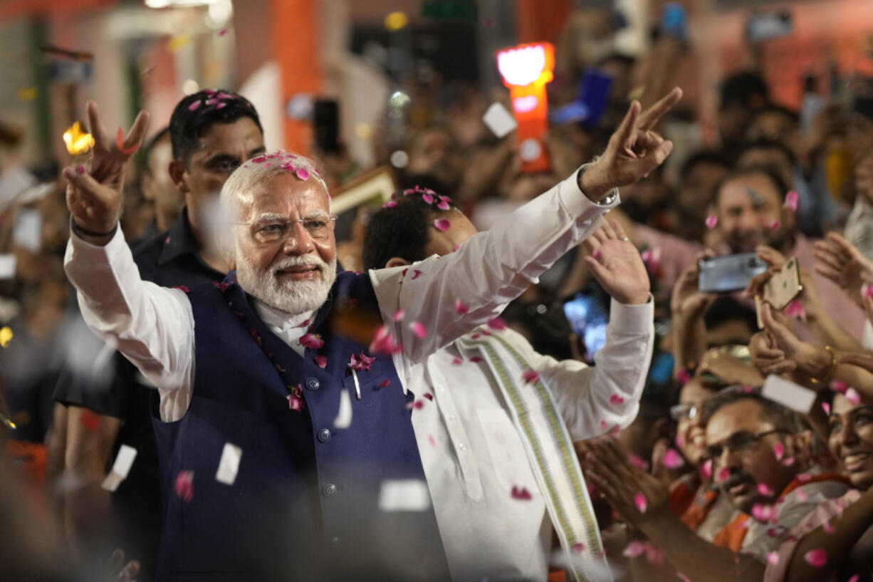 Indian Prime Minister Narendra Modi greets supporters as he arrives at Bharatiya Janata Party (BJP) headquarters after the election results were announced, in New Delhi, India, June 4, 2024.