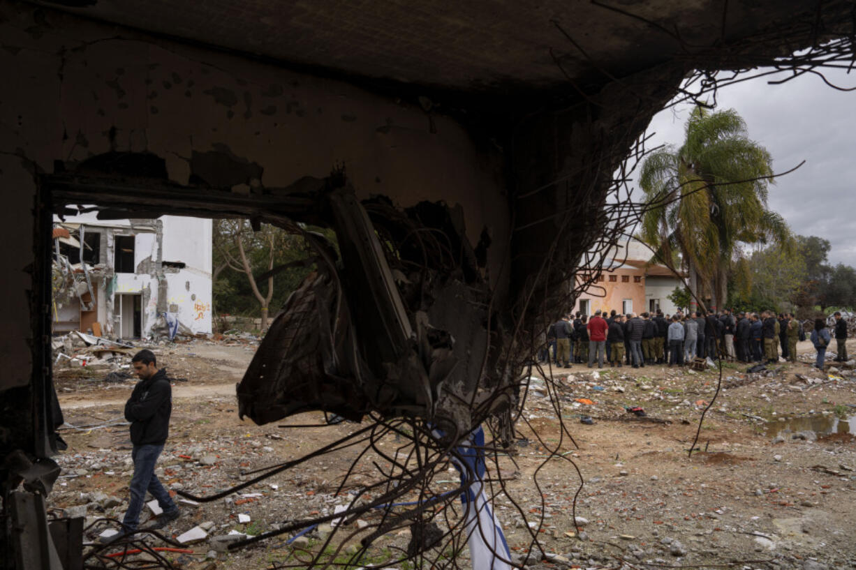 A group of Israelis visit a damaged house following the Oct. 7 Hamas militants attack on Israel in Kibbutz Beeri, southern Israel, on Friday, Jan. 28, 2024. A new kind of tourism has emerged in Israel in the months since Hamas&rsquo; Oct. 7 attack. For celebrities, politicians, influencers and others, no trip is complete without a somber visit to the devastated south that absorbed the brunt of the assault near the border with Gaza.