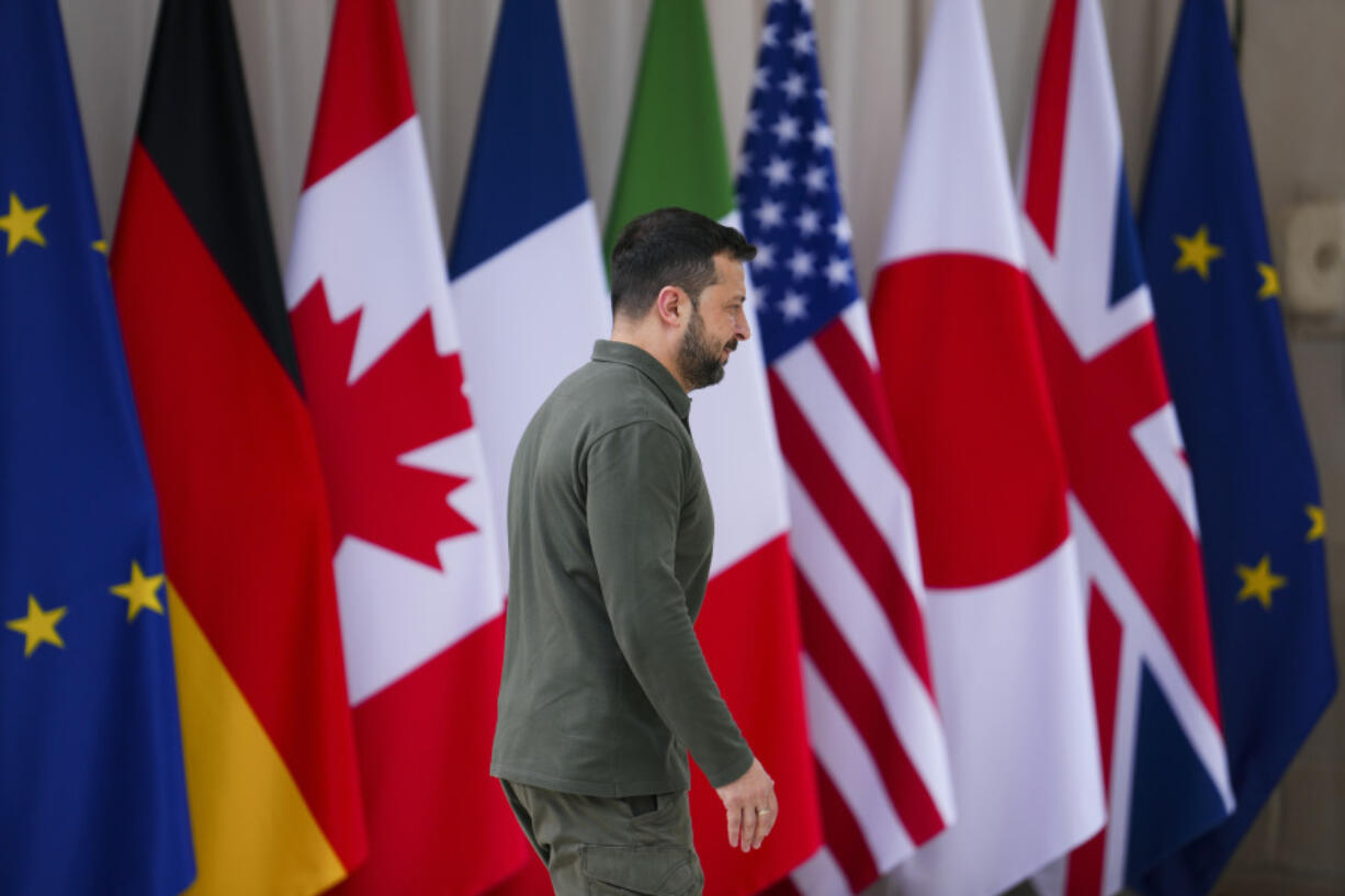 Ukrainian President Volodymyr Zelenskyy walks, on arrival at the G7, in Borgo Egnazia, Italy, Thursday, June 13, 2024, (Sean Kilpatrick/The Canadian Press via AP)