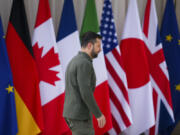 Ukrainian President Volodymyr Zelenskyy walks, on arrival at the G7, in Borgo Egnazia, Italy, Thursday, June 13, 2024, (Sean Kilpatrick/The Canadian Press via AP)