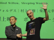 Novelist Haruki Murakami and film director Pierre Foldes shake hands at the end of a talk session June 15 after a screening of &ldquo;Blind Willow, Sleeping Woman,&rdquo; an animated film adapted from the Japanese author&rsquo;s short stories, in Tokyo.