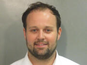FILE - This undated photo provided by Washington County, Ark., Detention Center shows Josh Duggar. The Supreme Court has rejected an appeal from Josh Duggar, a former reality television star convicted of downloading child sexual abuse images. Duggar was on the TLC show &ldquo;19 Kids and Counting&rdquo; with his large family before his 2021 conviction.