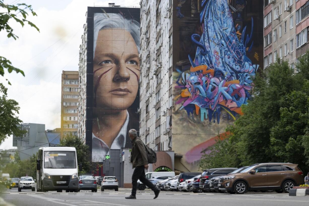 A mural showing WikiLeaks founder Julian Assange is seen on the wall of an apartment building in a street of the town of Balashikha outside Moscow, Russia, Wednesday, June 26, 2024. Assange has returned to his homeland Australia aboard a charter jet hours after pleading guilty to obtaining and publishing U.S. military secrets in a deal with Justice Department prosecutors that concludes a drawn-out legal saga.