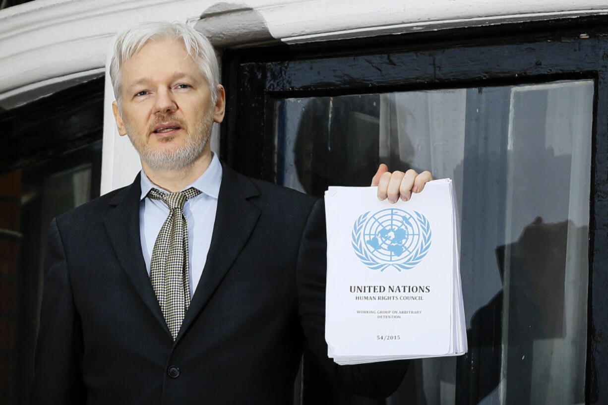 FILE - WikiLeaks founder Julian Assange speaks on the balcony of the Ecuadorean Embassy in London, Feb. 5, 2016. Assange will plead guilty to a felony charge in a deal with the U.S. Justice Department that will free him from prison and resolve a long-running legal saga over the publication of a trove of classified documents.