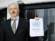 FILE - WikiLeaks founder Julian Assange speaks on the balcony of the Ecuadorean Embassy in London, Feb. 5, 2016. Assange will plead guilty to a felony charge in a deal with the U.S. Justice Department that will free him from prison and resolve a long-running legal saga over the publication of a trove of classified documents.