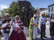 Participants read the names of United States Colored Troops at the African American Civil War Memorial as part of Juneteenth commemorations on Wednesday, June 19, 2024, in Washington.